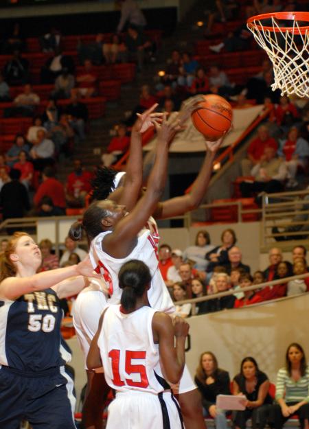 LaTorya Fuller and DJ Sissoko fight for a rebound during the first round of the NAIA National Tournament against The Master's College (Calif.). Union won the game 86-55. - Photo by Morris Abernathy