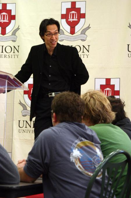 Makoto Fujimura, guest artist and speaker, talks with faculty and students during a luncheon held after chapel. - Photo by Stephanie Schroeder