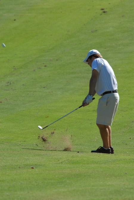 Matt Kelley hits an iron shot from the middle of the fairway during the Union Invitational at Falcon Ridge Golf Club. - Photo by Morris Abernathy