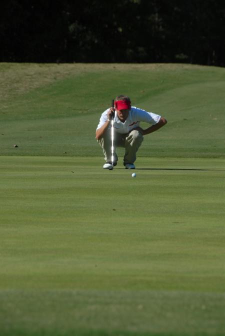Gary Glapa surveys the line of his put during the Union Invitational at Falcon Ridge Golf Club. - Photo by Morris Abernathy