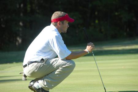 Gary Glapa eyes the lay of the green prior to one of his puts at the Union Invitational at Falcon Ridge Golf Club. - Photo by Morris Abernathy