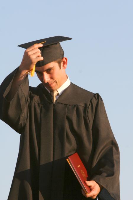 Biology graduate Justin Hutto turns his tassel after receiving his diploma at the spring 2007 graduation ceremony. - Photo by Kyle Kurlick