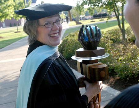 Faculty Member of the Year Dottie Myatt carries the mace in front of the faculty processional preceding spring 2007 graduation. - Photo by Stephanie Schroeder