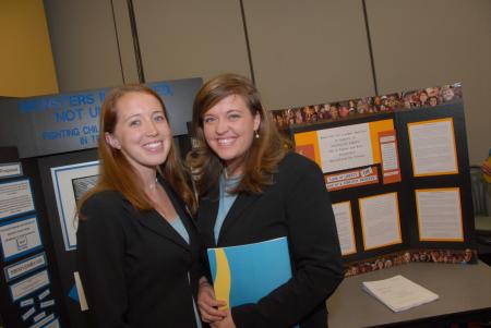 Junior Social Work Majors Julie Mitchel and Amanda Pennington pose in front of their poster presentation entitled <em>Monsters in the Bed, Not Under It: Fighting Child Sex Servitude in Tennessee</em> at the 2007 Scholarship Symposium. - Photo by Morris Abernathy