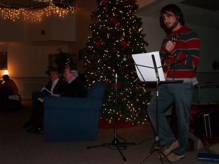 Cody Curtis led singing before President Dockery read the Christmas story in McAfee. - Photo by Beth Spain