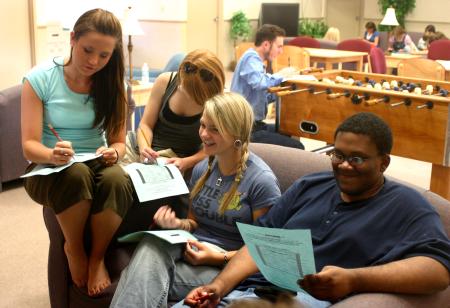Rising Seniors Jordan Frye, Laura Barnes and Nigel Manuel laugh and discuss a survival strategy based on a personality test. - Photo by Stephanie Schroeder