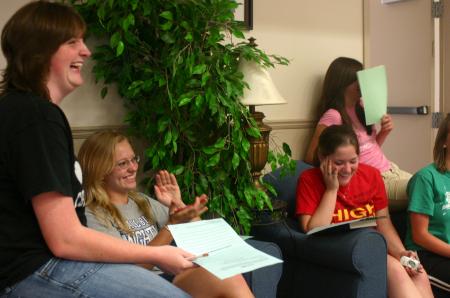 Rising Seniors Tiffany Knight, Haley Winter and Molly Merck laugh as they discuss a plan of survival that they had been challenged with. - Photo by Stephanie Schroeder