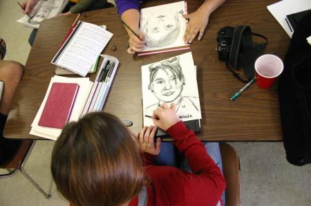 Students at the art retreat took turns creating portraits of each other. - Photo by Stephanie Schroeder