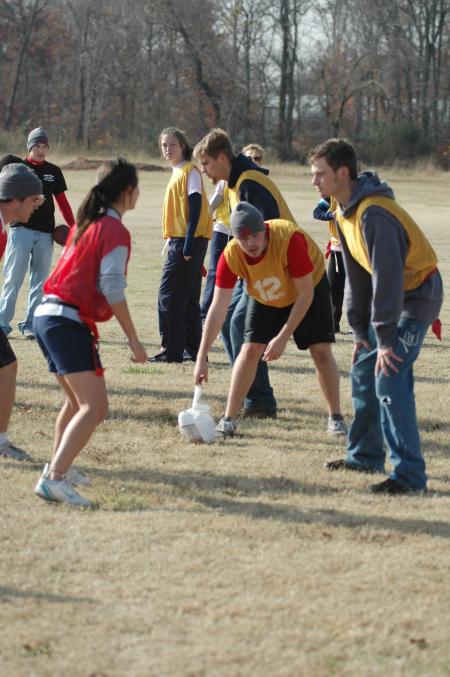 The Sophomore class enjoys playing flag football with a turkey at the annual Turkey Bowl. - Photo by Holly Gushee