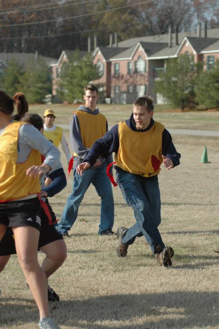 Josh Brooks runs around the end for a pass at the annual Turkey Bowl. - Photo by Holly Gushee
