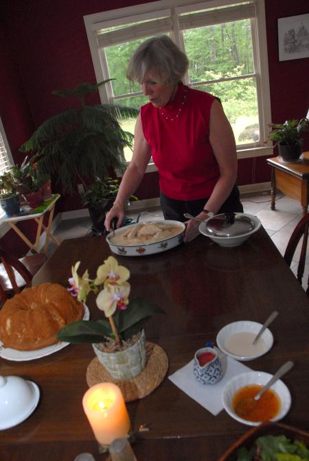Nan Thomas, associate director of faculty development, prepares a meal for students during Be Our Guest. - Photo by Morris Abernathy
