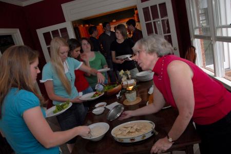 Nan Thomas, associate director of faculty development, hosts students for a meal during Be Our Guest. - Photo by Morris Abernathy