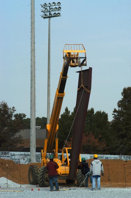 Steel beams are moved into place for White Hall. - Photo by Morris Abernathy