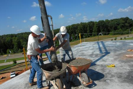 Concrete is moved onto the White Hall structure. - Photo by Morris Abernathy