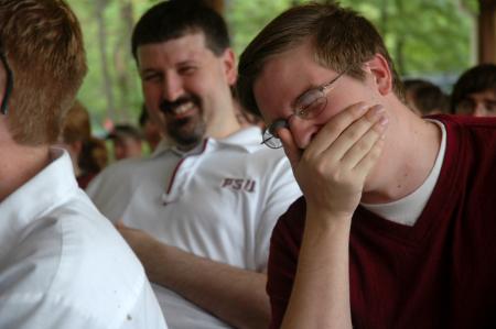 Junior Journalism Major Tyler Whetstone and Web Development Agent Cam Tracy enjoy a joke told at the Communication Arts Awards. - Photo by Beth Spain