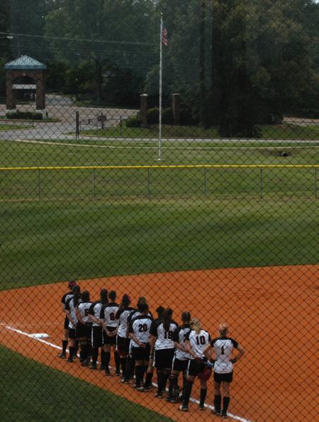 Union players gather down the third base line in preparation for the playing of the National Anthem. - Photo by Steven Aldridge