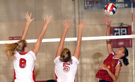 Amanda Hutchison and Linday Holmes team up for the block. - Photo by Steven Aldridge