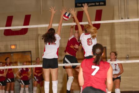 Elena Villagomez and Amanda Hutchison team up for the block. - Photo by Steven Aldridge