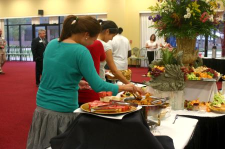 Kayla Powell and other students enjoyed refreshments made by Chef Greg at the President's Reception in Coburn. - Photo by Stephanie Schroeder