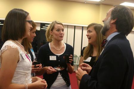 Hal Poe, Charles Colson professor of faith and culture, enjoys a conversation with students and staff such as Julie Dockery (center) and Amanda Pennington. - Photo by Stephanie Schroeder