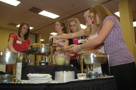 Students helped themselves to some chicken at the President's Reception. - Photo by Neisha Fuson