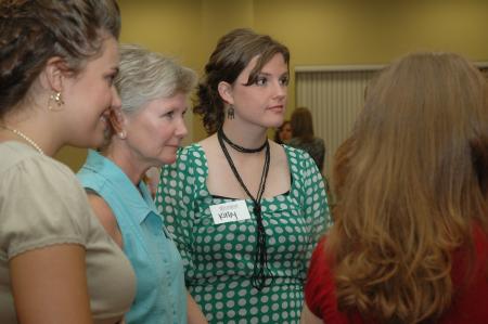 Natalie Newberry, Pam Sutton and Kirby Maxwell fellowship with others during the President's Reception. - Photo by Neisha Fuson