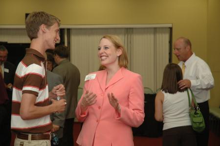 Dean of Students Kimberly Thornbury enjoys talking with Ryan Hoover, of West Memphis, Ark., during the President's Reception. - Photo by Neisha Fuson