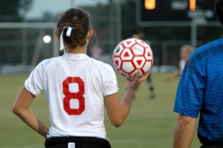 Sophomore Roxanna Skelton prepares to throw the ball in from the sidelines. - Photo by Matt Elia