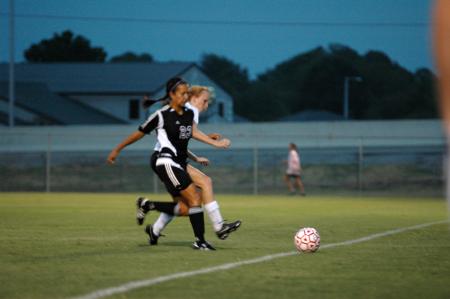 Sophomore Nursing Major Brooke Walker battles with a Bethel opponent for possession of the ball. - Photo by Matt Elia