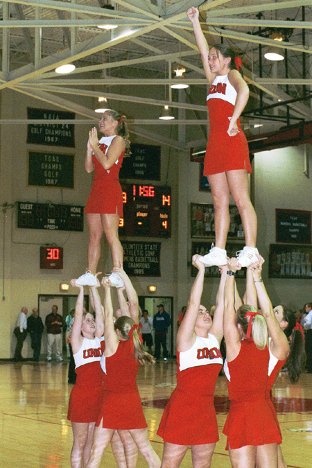 The Union University cheerleaders get the crowd pumped during a time out. - Photo by Jim Veneman