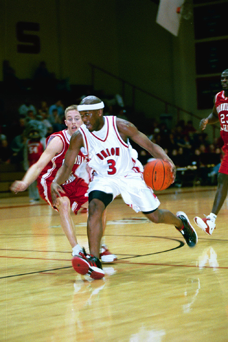Junior Chima Abakwue (3) drives past Hannibal La-Grange's defense in Union's 66-51 homecoming win. - Photo by Justin Veneman