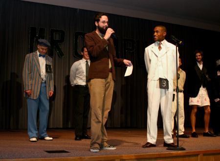 Emcee Joe Garner asks Darrion Garrett a question during the question and answer part of Mr. Campus. - Photo by Stephanie Schroeder