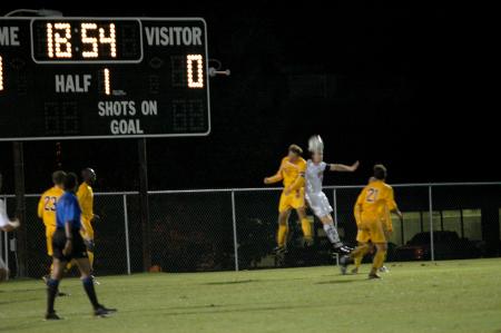 With the game still tied at zero, a Bulldog  defender gets the best of this battle for the header. - Photo by Matt Elia