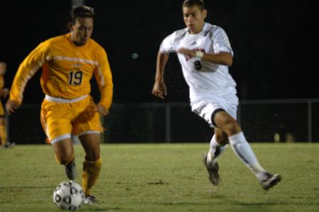 Junior Wagner Oliveira pursues a Trevecca Nazarene player.  Union took the match 2-1 on a rain-soaked field. - Photo by Matt Elia