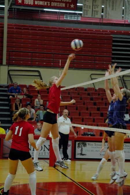 Junior Amanda Hutchison Coyle springs into the air to return the ball to Trevecca Nazarene University.  - Photo by Neisha Fuson