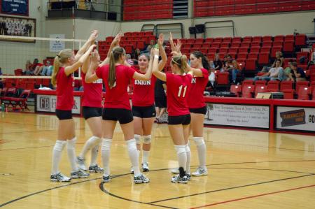 The Lady Bulldogs huddle up on the court to prepare for the next set against Trevecca Nazarene University.  - Photo by Neisha Fuson