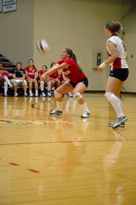 Junior Tiven Catrett sets the volleyball from deep in the court against Trevecca Nazarene University.  - Photo by Neisha Fuson