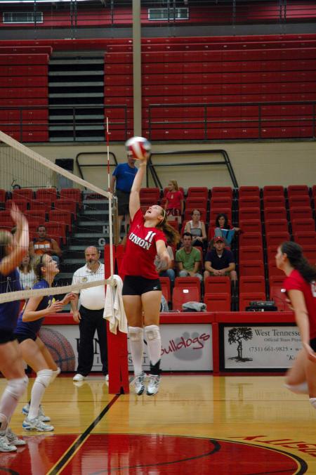 In the game against Trevecca Nazarene University, Junior Jennifer Martins taps the volleyball back to the other side of the net.  - Photo by Neisha Fuson