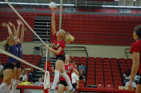 Junior Amanda Hutchison Coyle spikes the volleyball against Trevecca Nazarene University.  - Photo by Neisha Fuson