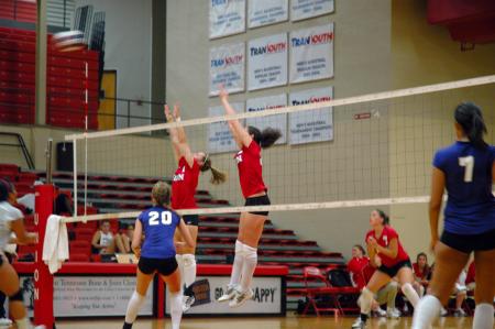 The Lady Bulldogs try to block the volleyball in their game against Trevecca Nazarene University.  - Photo by Neisha Fuson