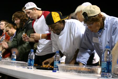 Seniors Ryan Merriman and Mack Bealim participate in the Chick-fil-A Nugget Eating Contest. - Photo by Stephanie Schroeder