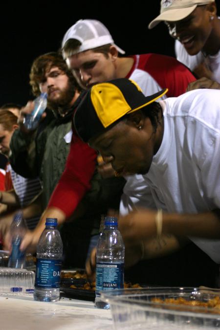 Seniors Ryan Merriman and Mack Bealim participate in the Chick-fil-A Nugget Eating Contest. - Photo by Stephanie Schroeder