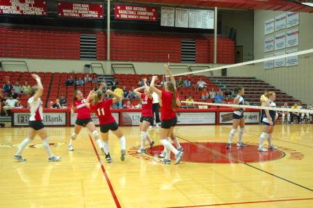 The Lady Bulldogs celebrate after they score a point against their opponents from Mid-Continent University - Photo by Neisha Fuson