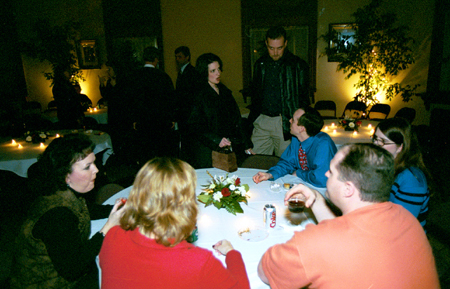 Members of the Class of '78 and '93 spend time catching up at their 10-year reunion held at the Carnegie Library during Homecoming 2003. - Photo by Jim Veneman