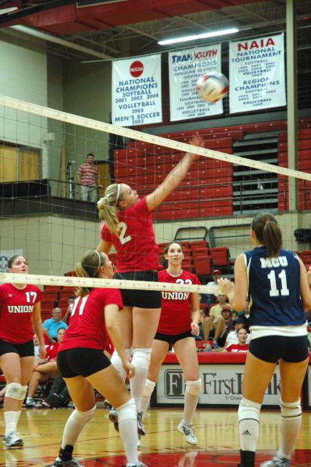 Junior CJ Neathamer taps the volleyball back over to Mid-Continent University.  - Photo by Neisha Fuson