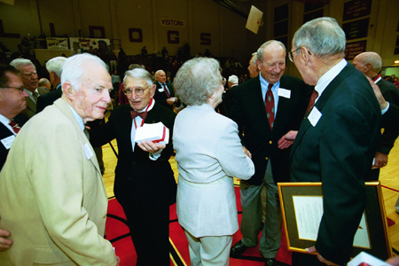 Members of Union's football teams fellowship shortly after being honored at Homecoming 2003. - Photo by Jim Veneman