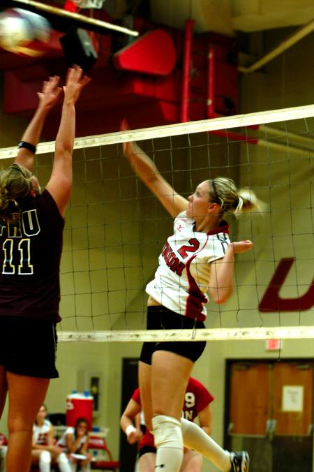 Junior CJ Neathamer again attacks Freed-Hardeman with a well-placed spike. - Photo by Matt Elia