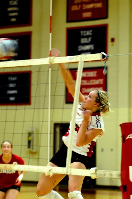 Junior CJ Neathamer spikes a well-placed set over the net. - Photo by Matt Elia