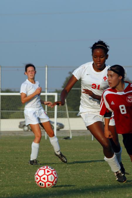 Freshman Eboni Murphy attempts to gain possession  of the ball during a game against Lyon College.  - Photo by Neisha Fuson