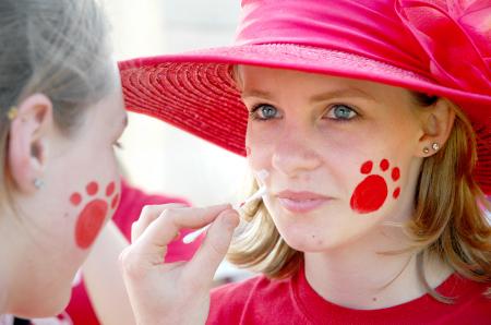 Senior Emily Watlington, social work major, gets her face painted before a Lady Bulldog soccer match. - Photo by Matthew Diggs